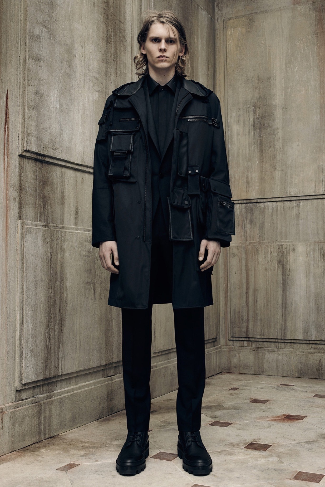 black relaxed coat and slim pants