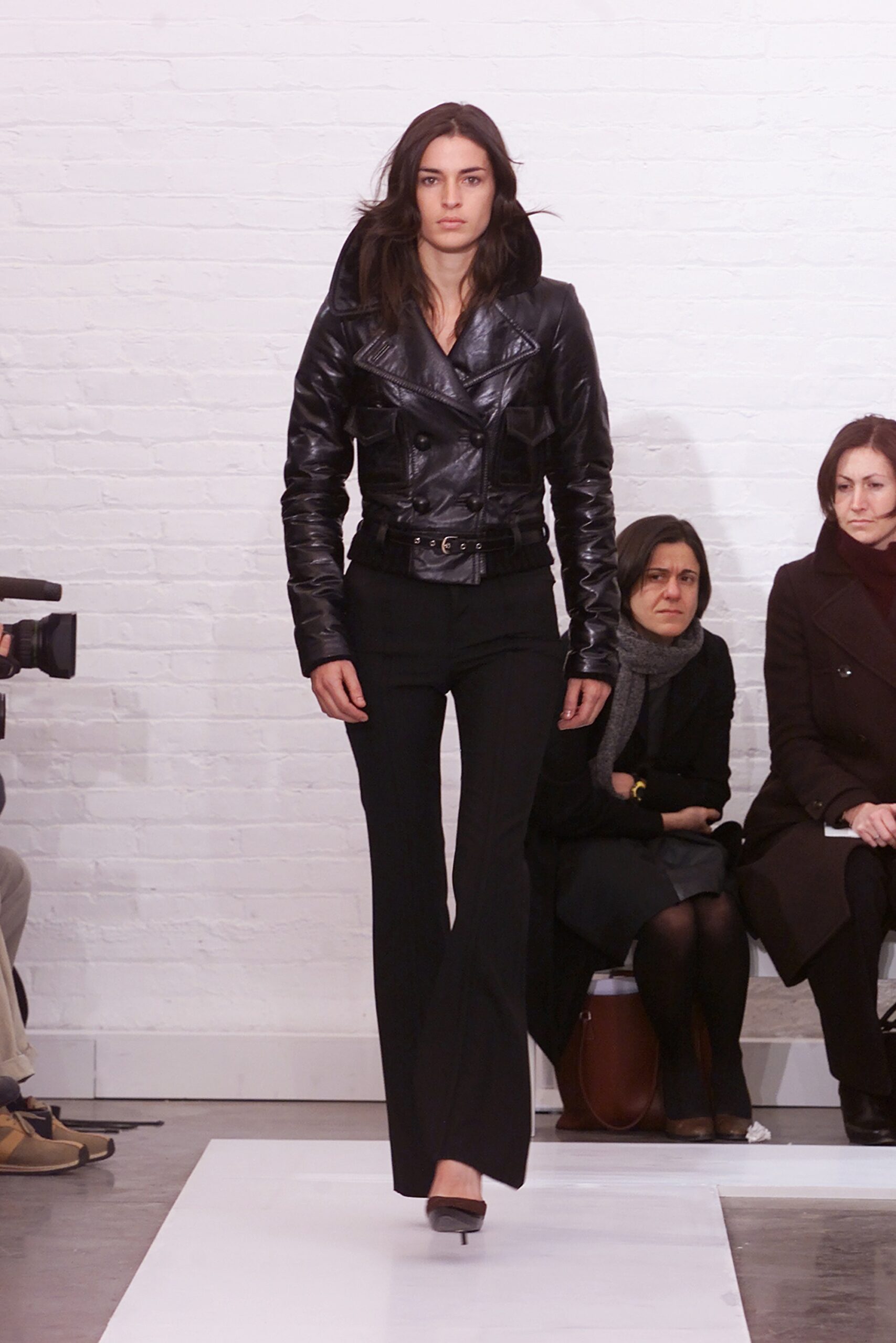 black leather fitted jacket and flared pants