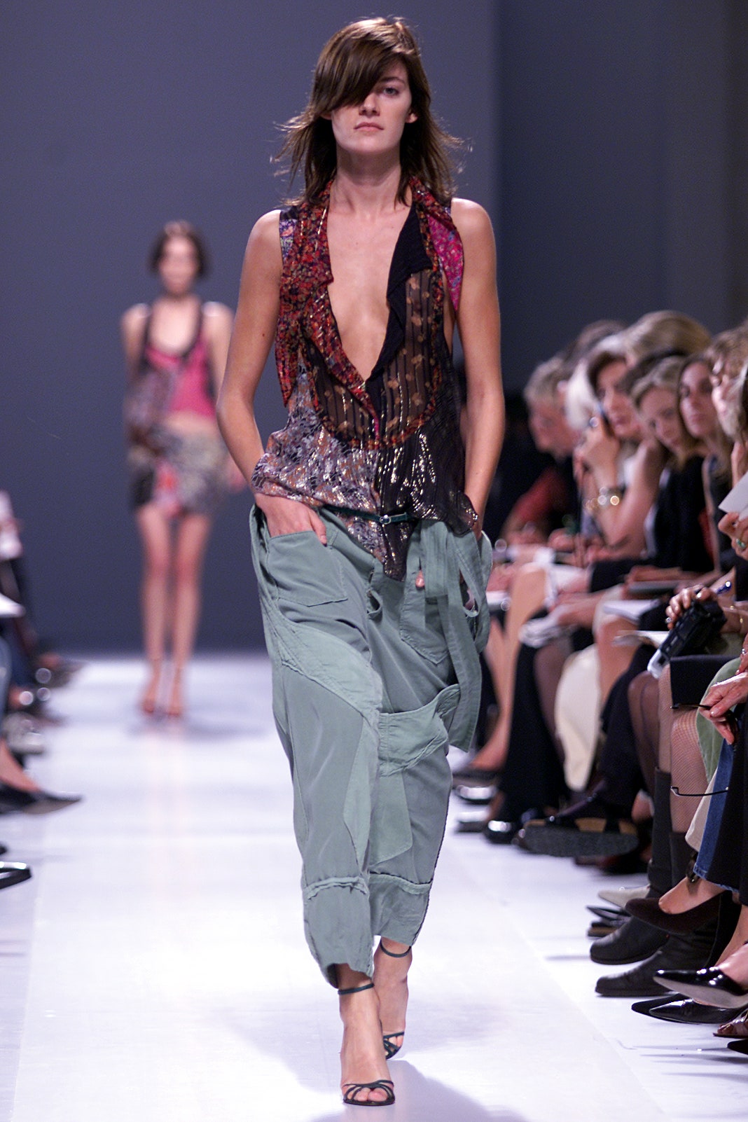 fitted black sequin top and relaxed green cargo pants