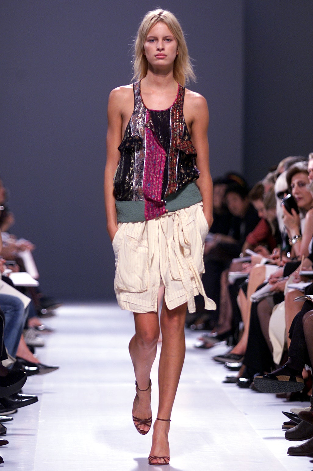 multi-colored sleeveless top with beige shorts