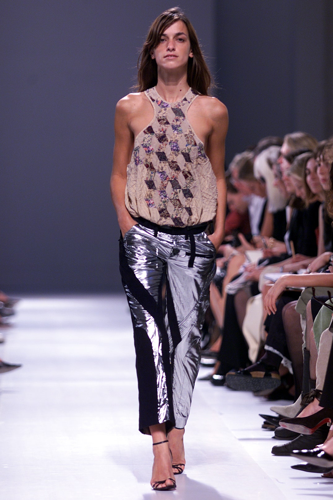 beige printed halter top and shiny pants