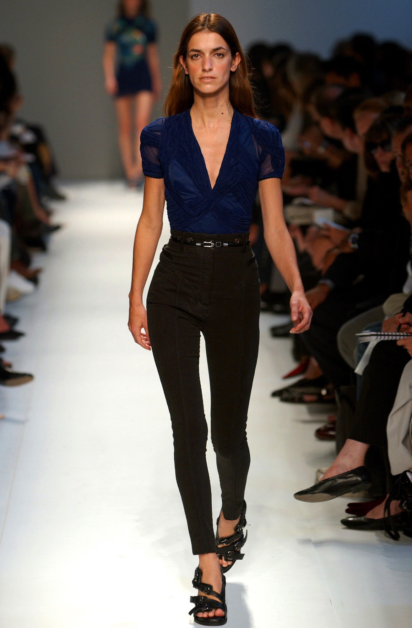 blue fitted top with black pants