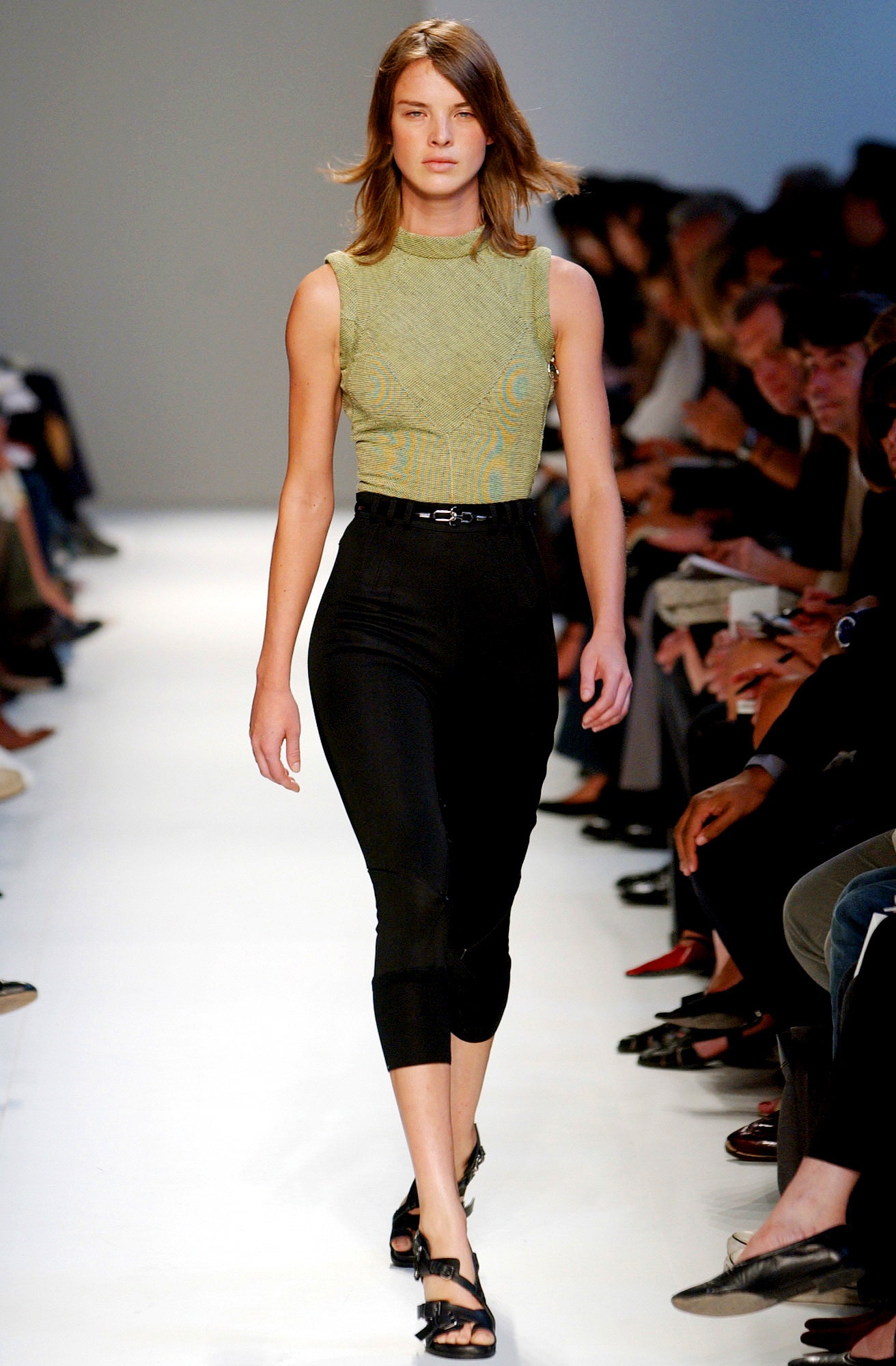 fitted green top and black pants