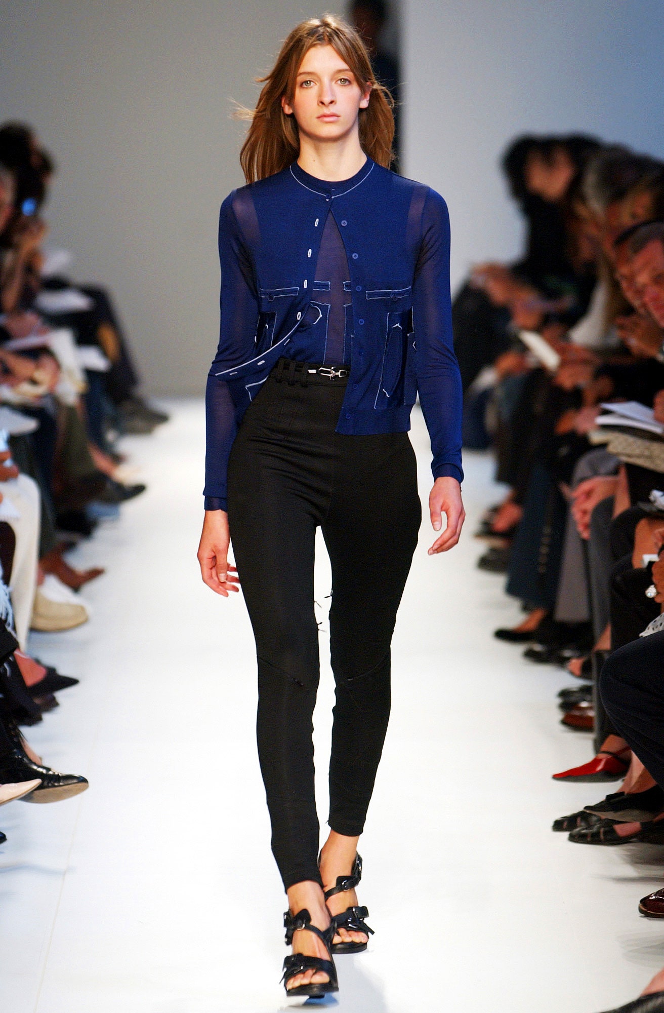 blue fitted top with black pants