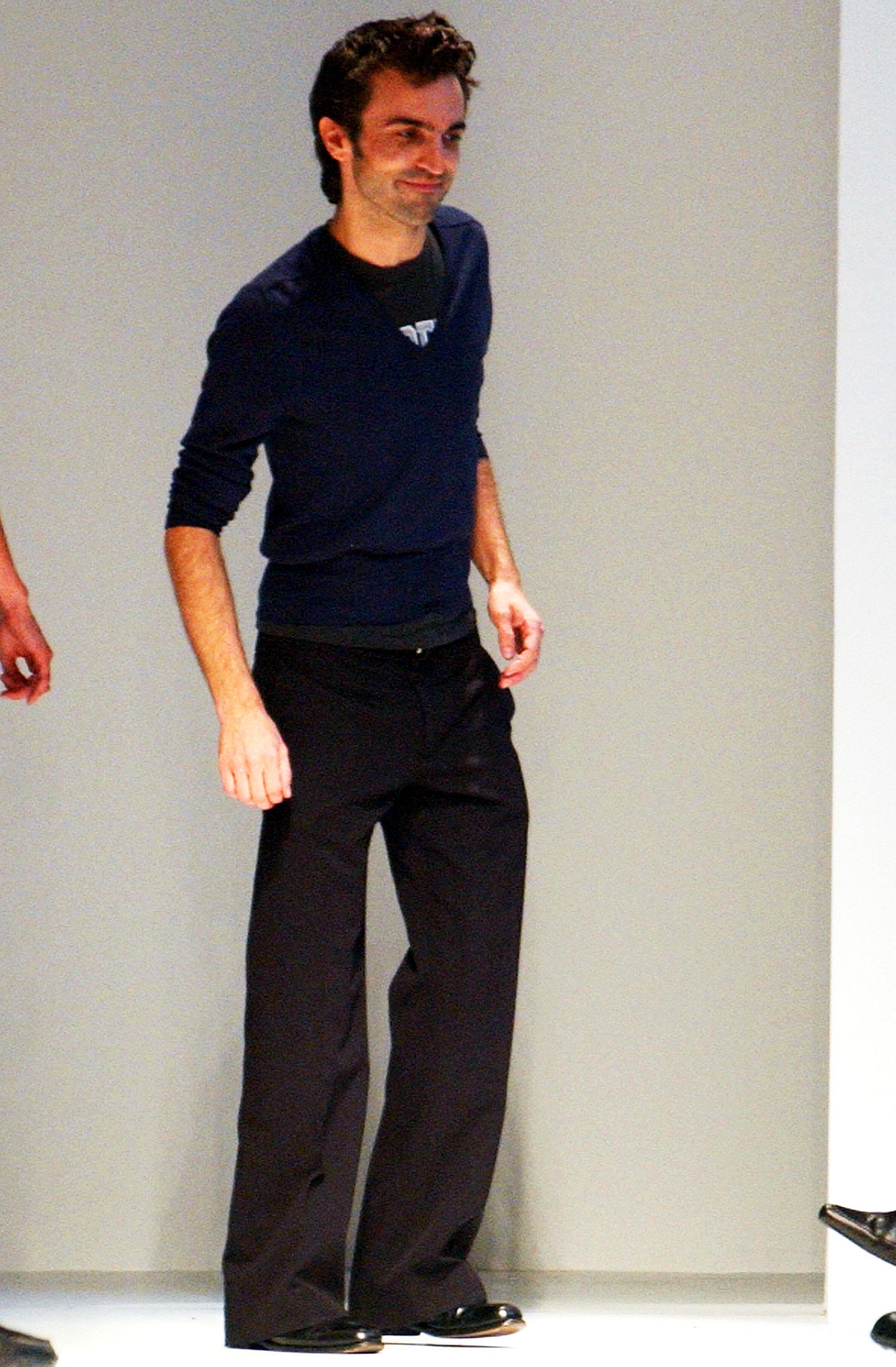 blue fitted top and black pants