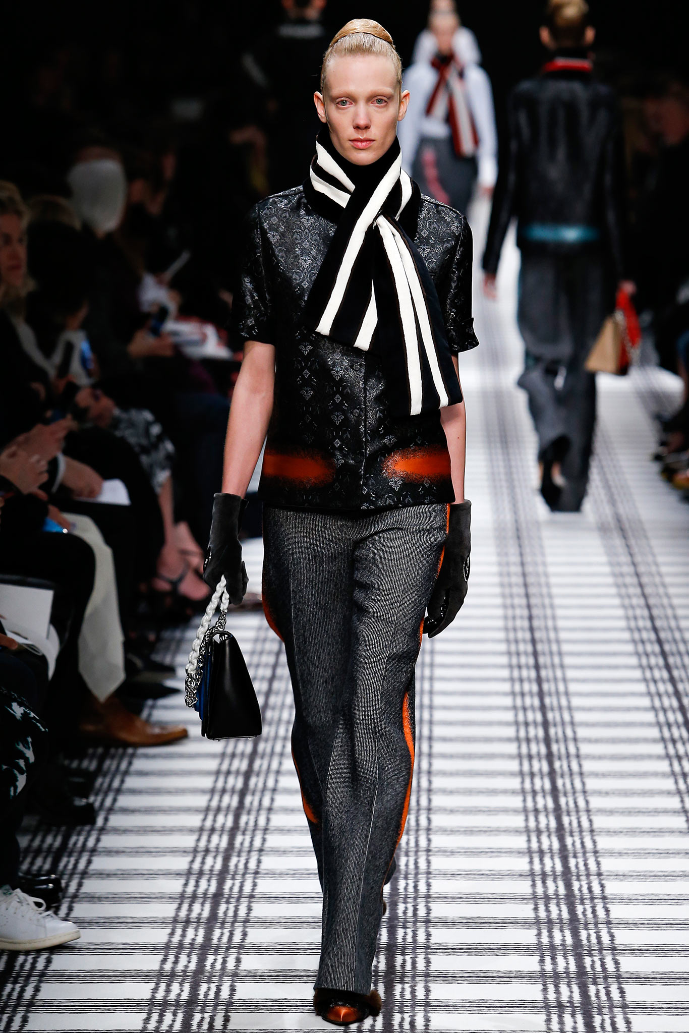 black and white embroidered top with tailored pants