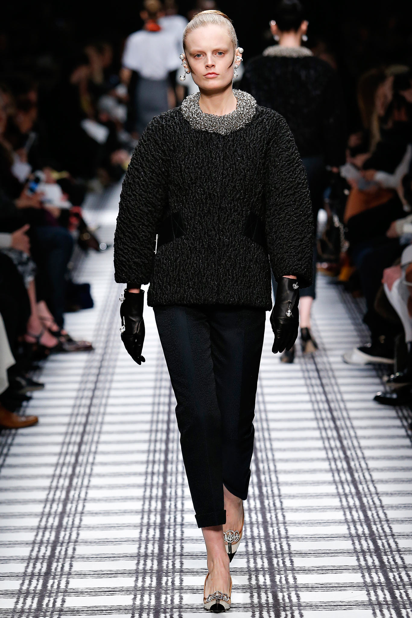 black textured top with fitted pants