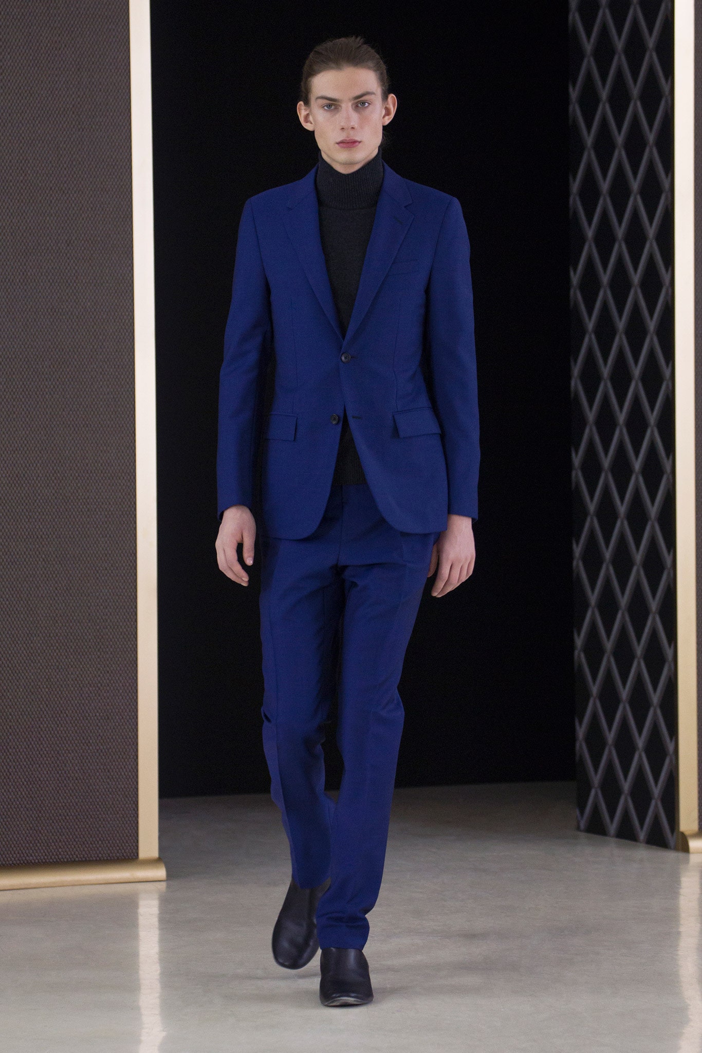 blue tailored suit with black shoes
