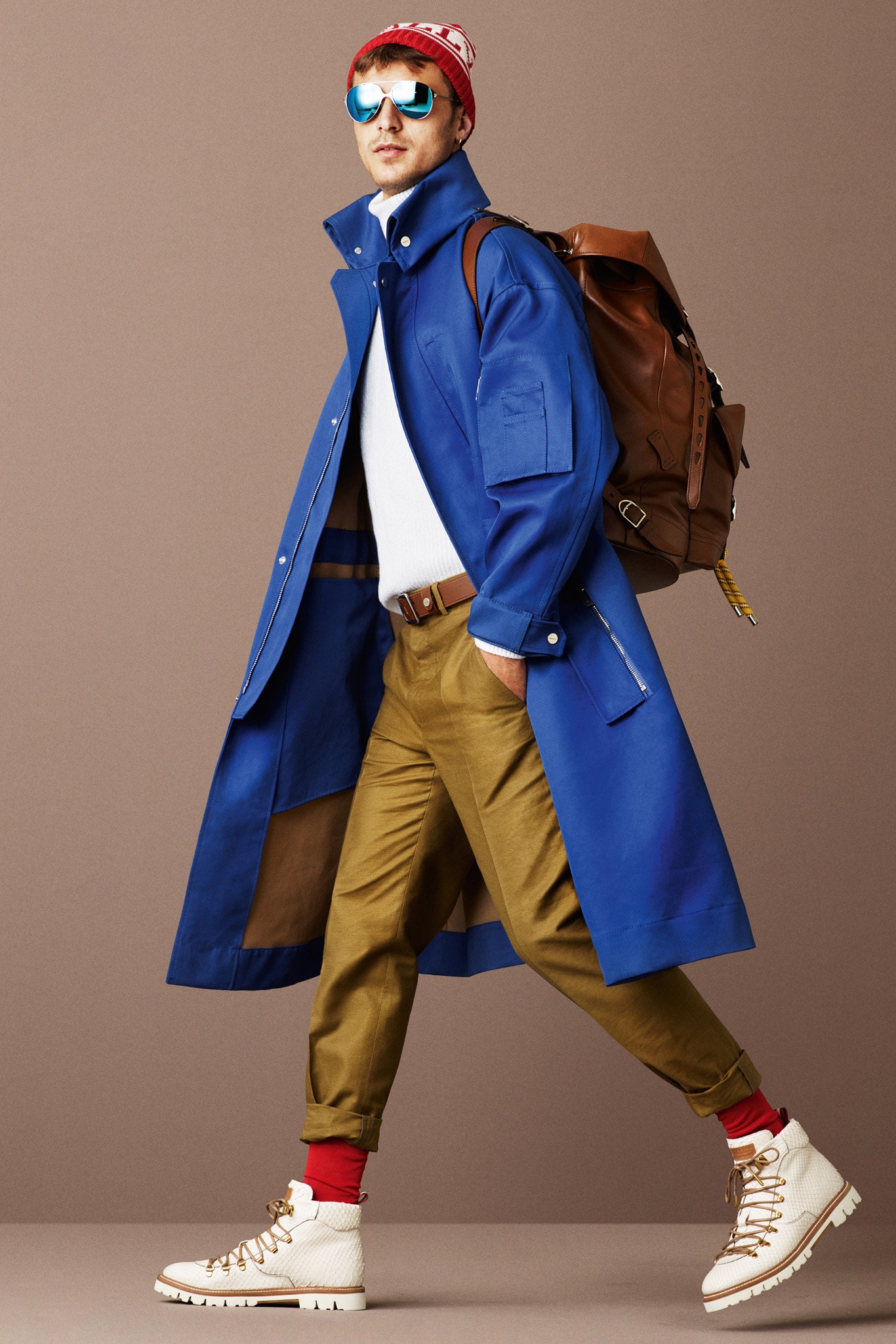 blue vinyl coat with beige pants