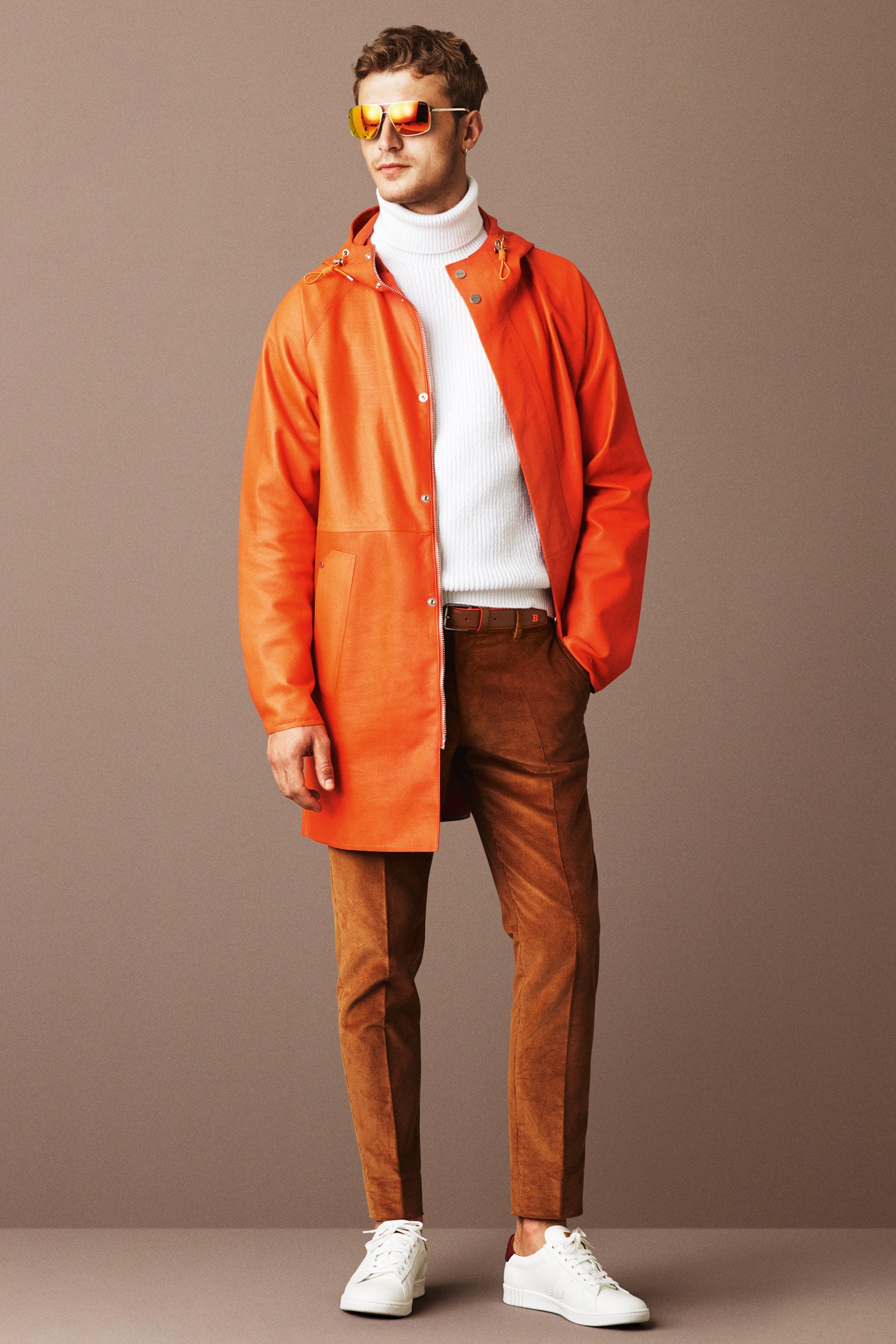 orange leather jacket with white sweater