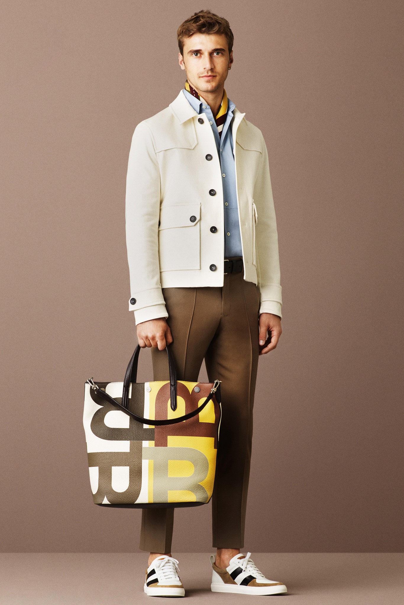 white jacket blue shirt brown pants
