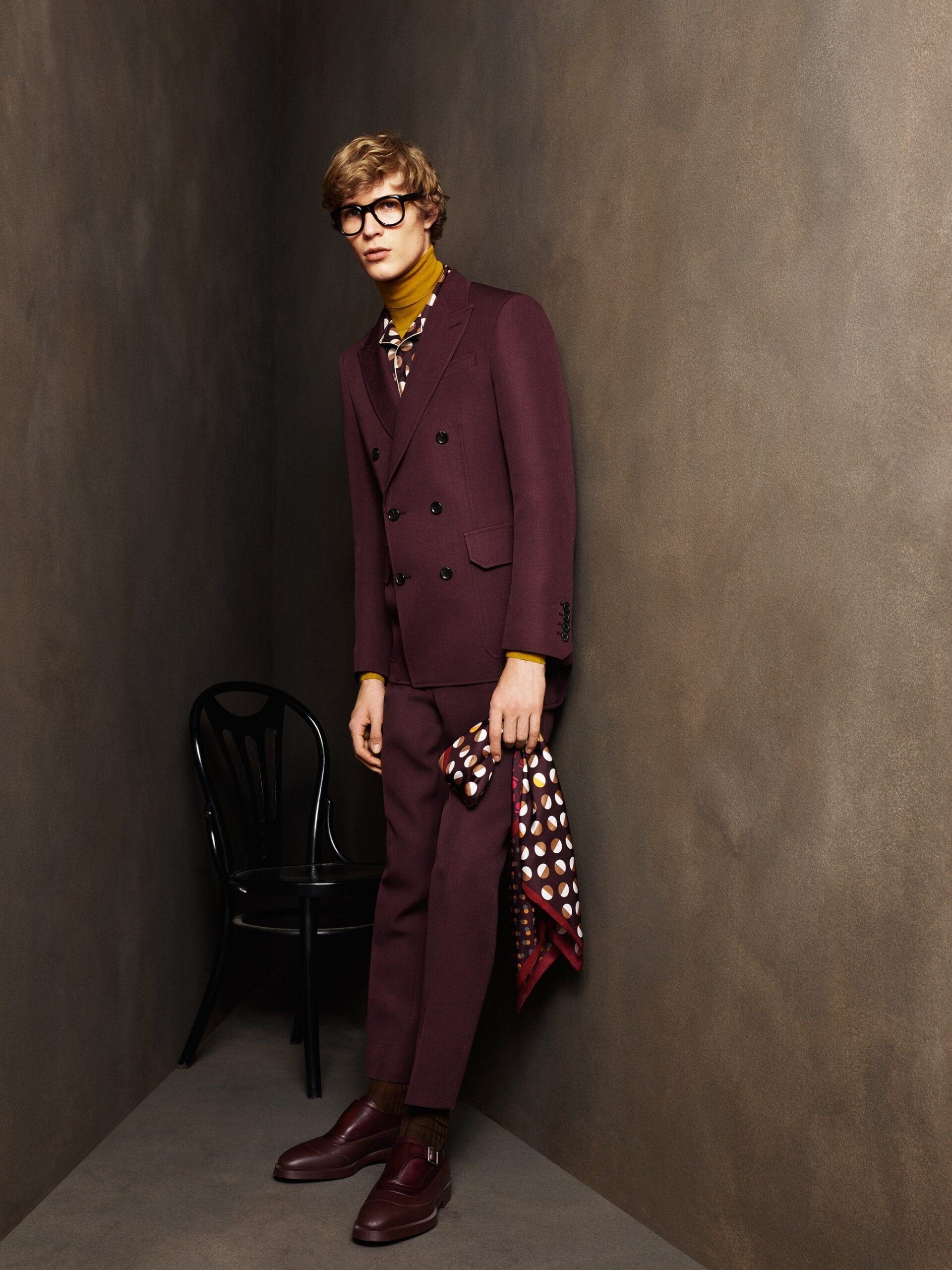 maroon tailored suit with yellow shirt