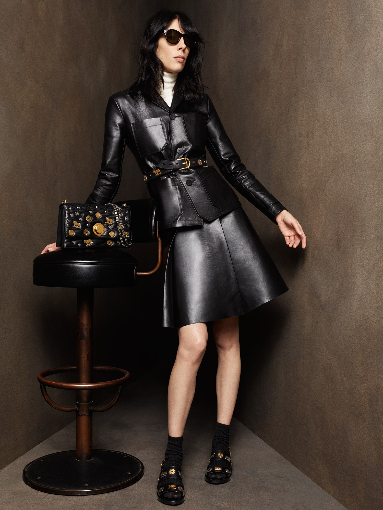 black leather fitted jacket and skirt