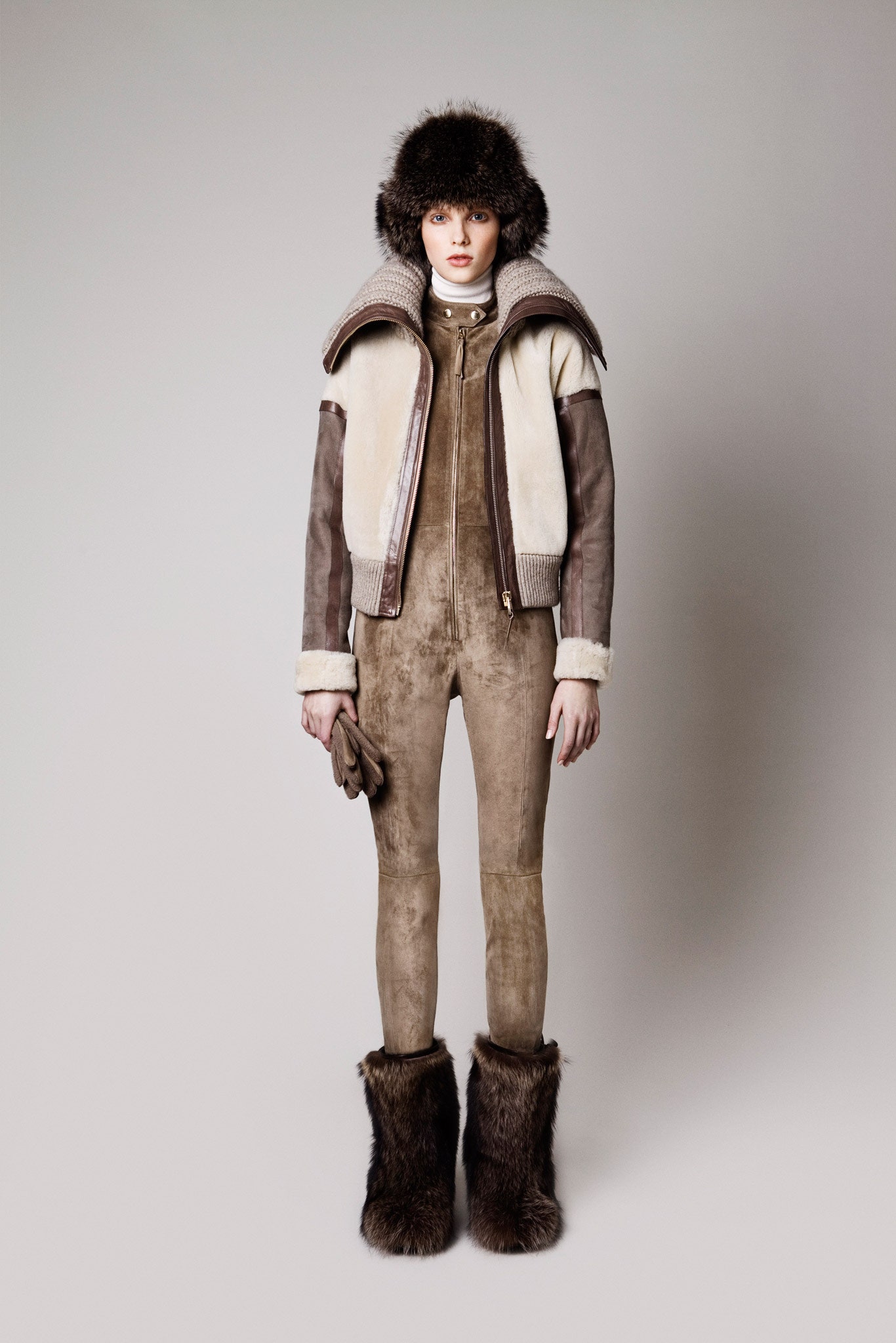 brown leather jacket and beige jumpsuit