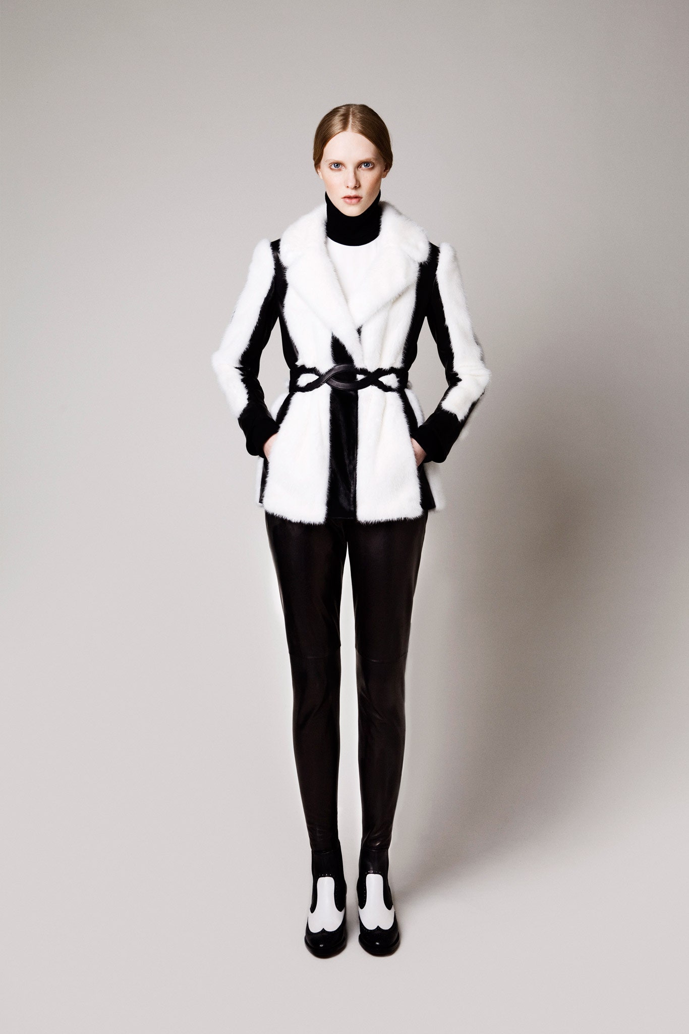 fitted black and white fur coat with leather pants