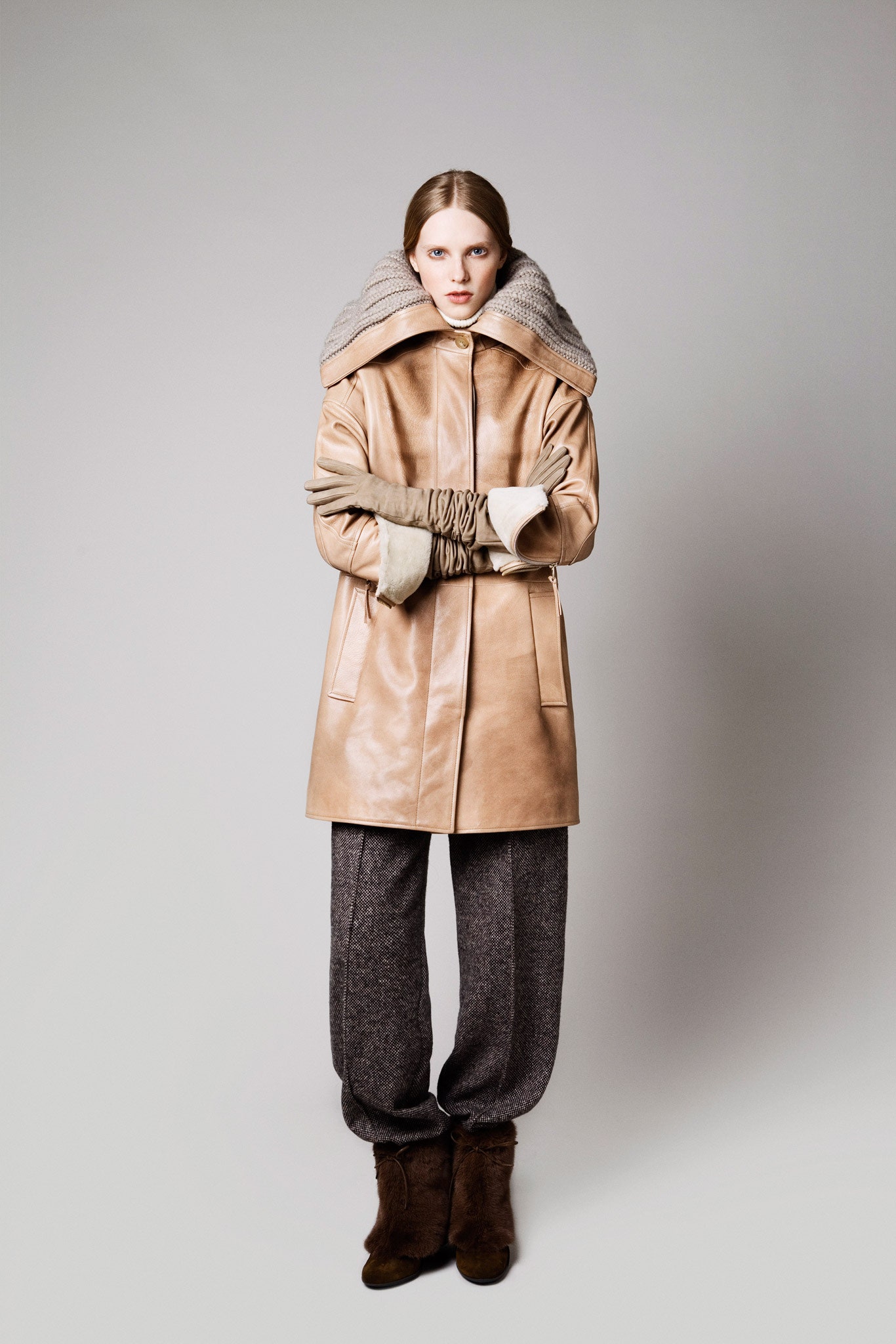 beige leather coat with gray pants