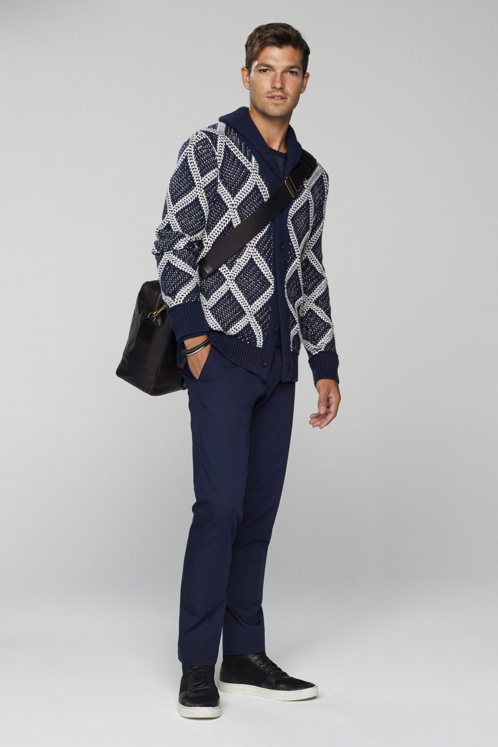 navy patterned sweater with black pants