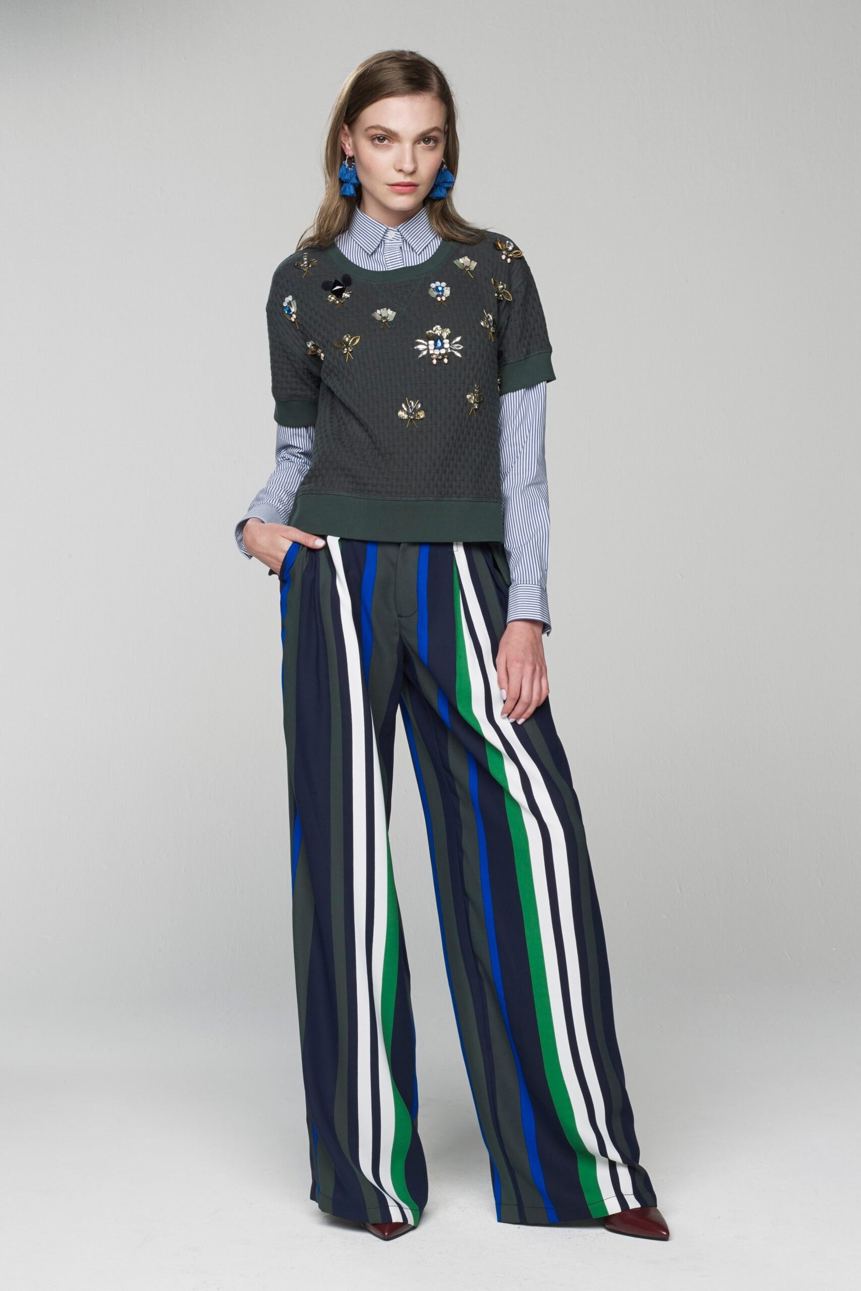 gray embroidered top with striped pants