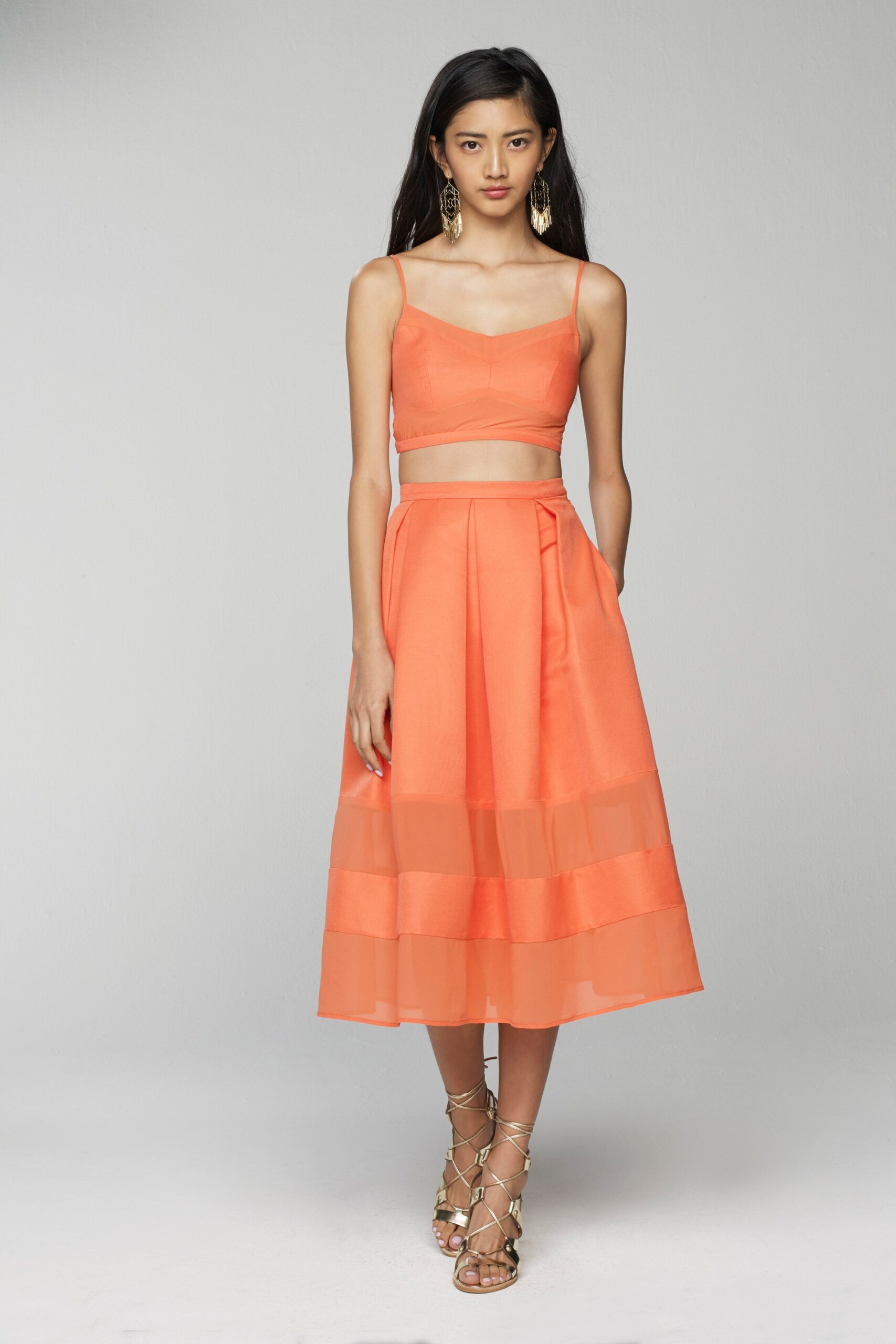 orange crop-top and midi skirt