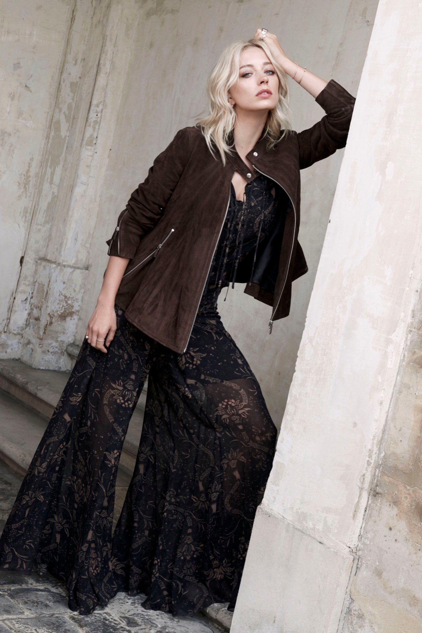 brown suede fitted jacket and black lace jumpsuit