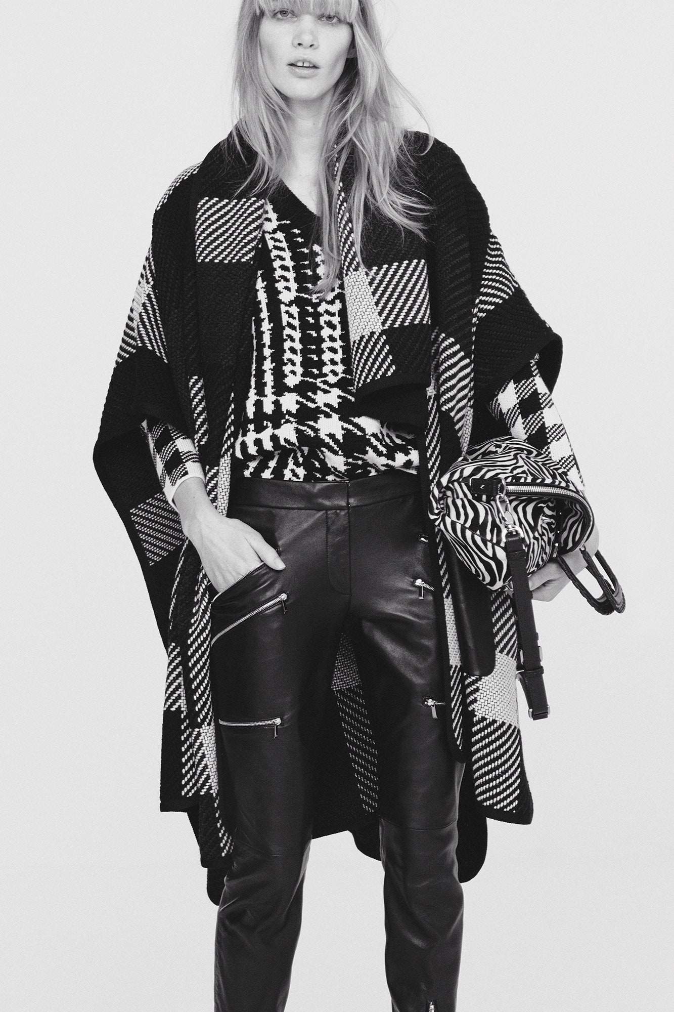 black and white poncho with leather pants