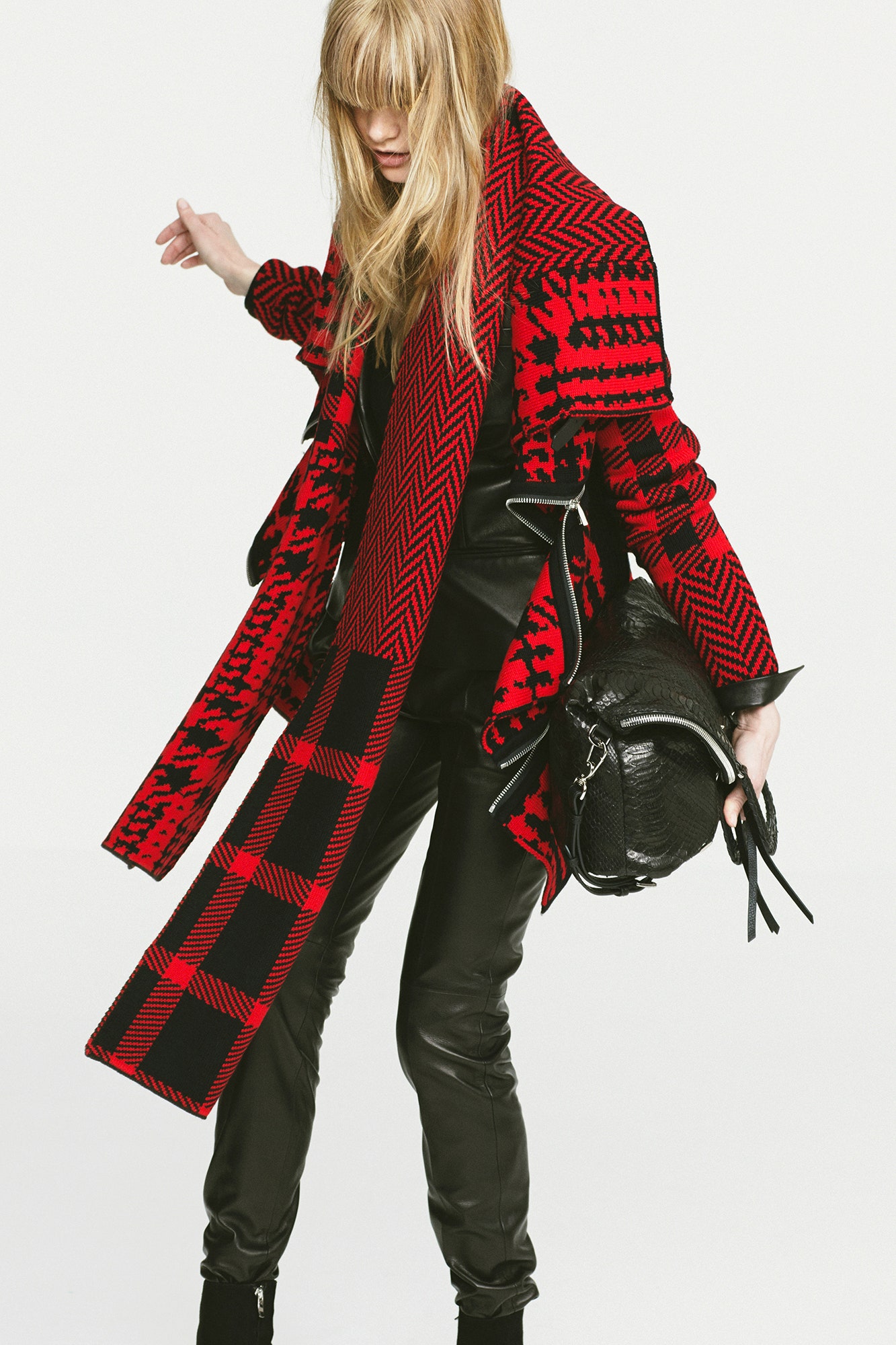 red and black checked coat with leather pants