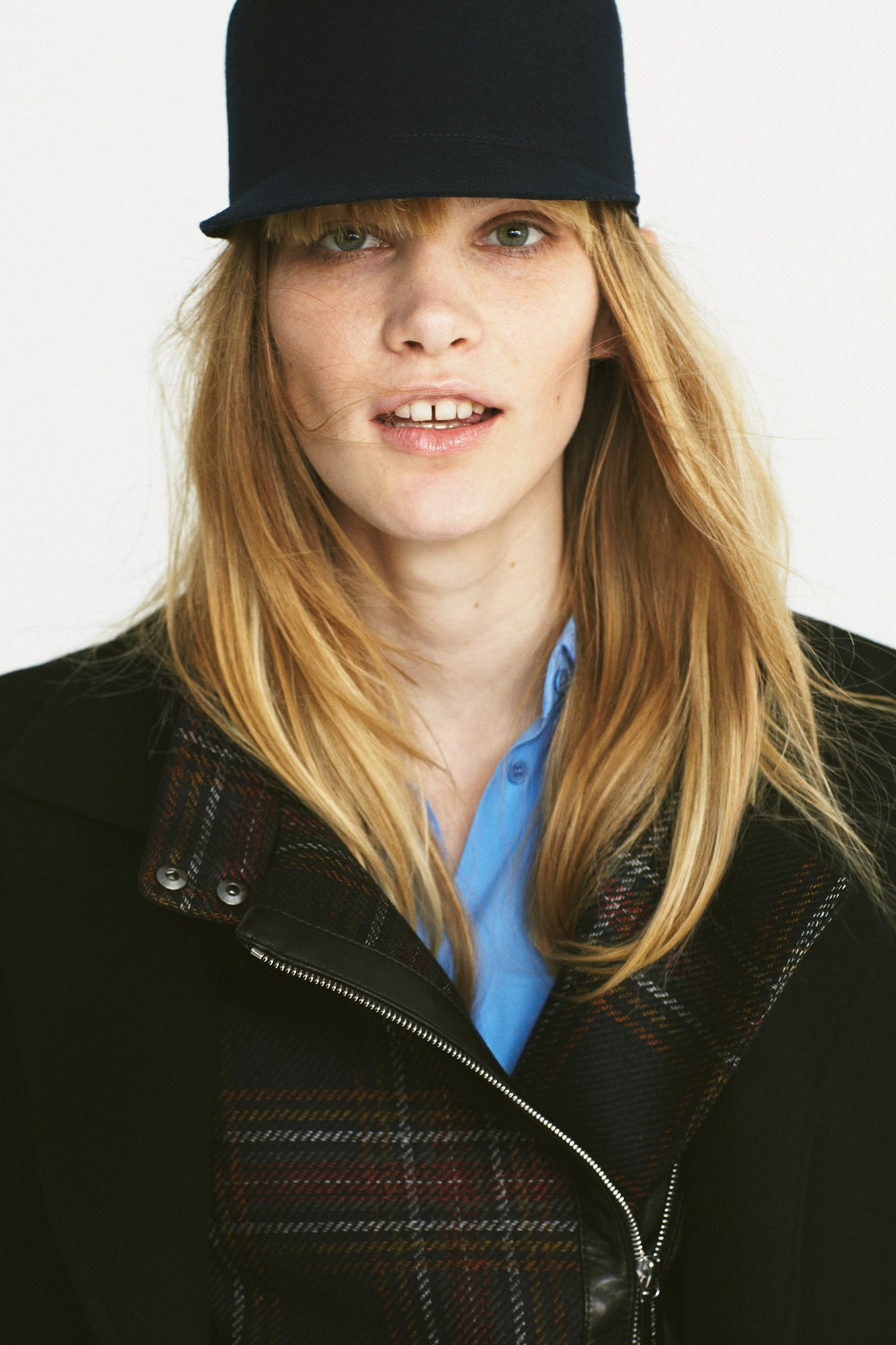 black wool coat with blue shirt