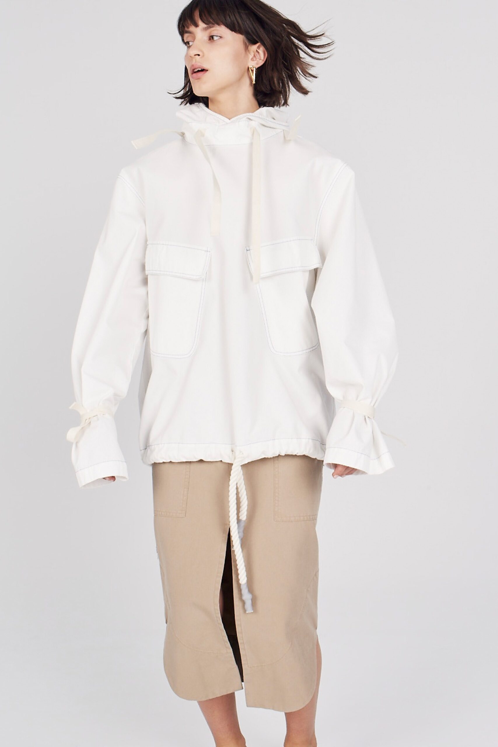 white oversized jacket and beige skirt