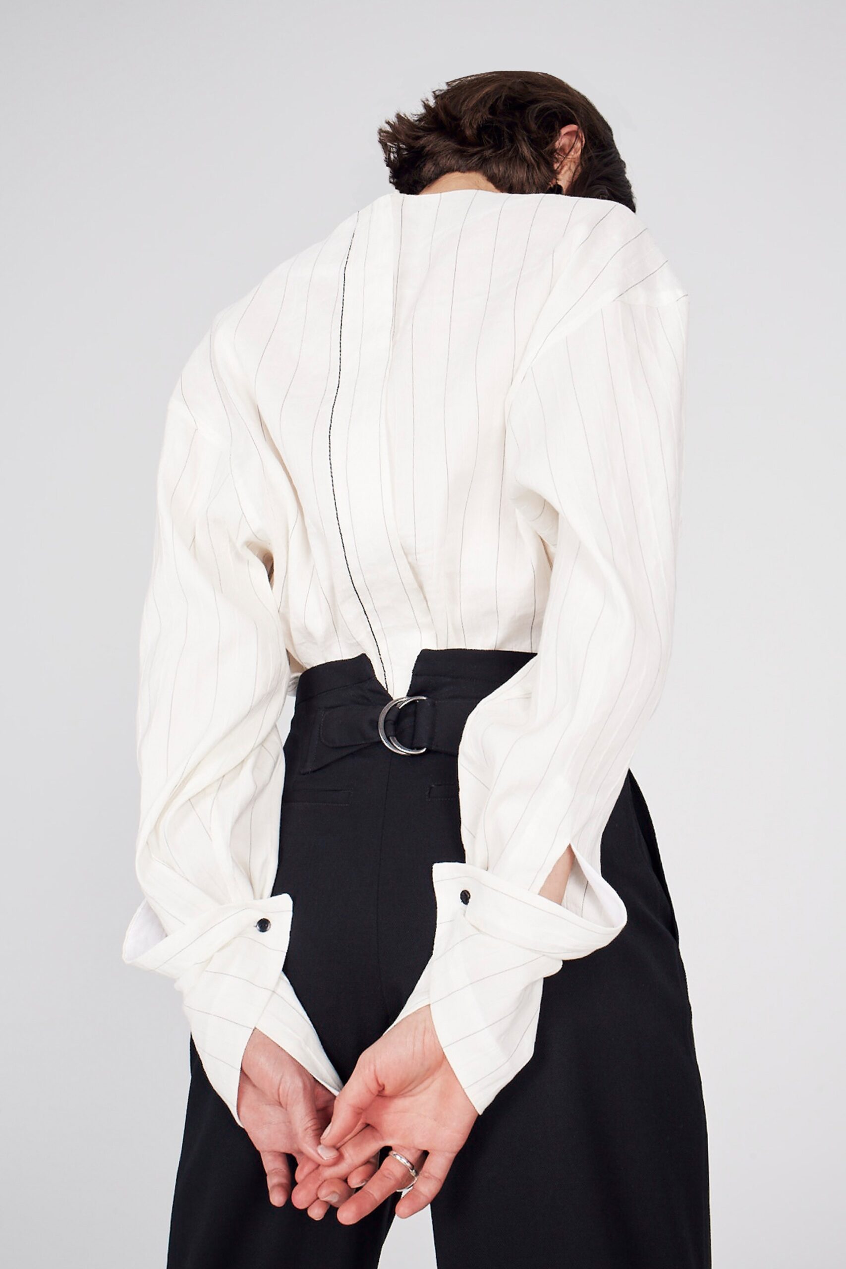 white relaxed shirt and black tailored pants