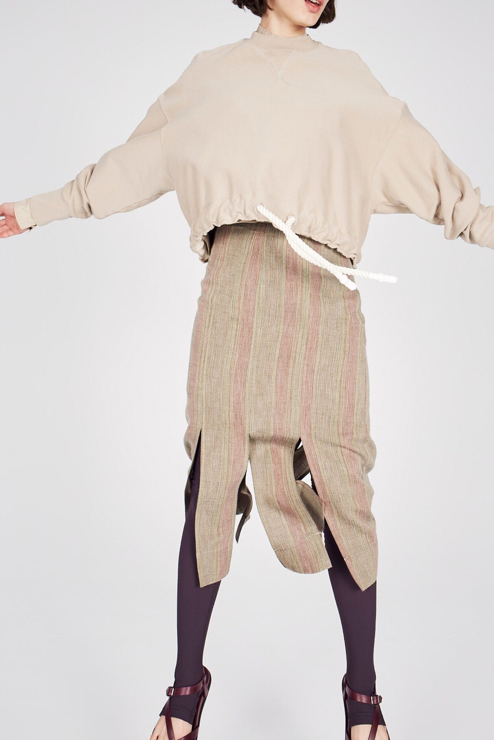 beige oversized top with multi skirt