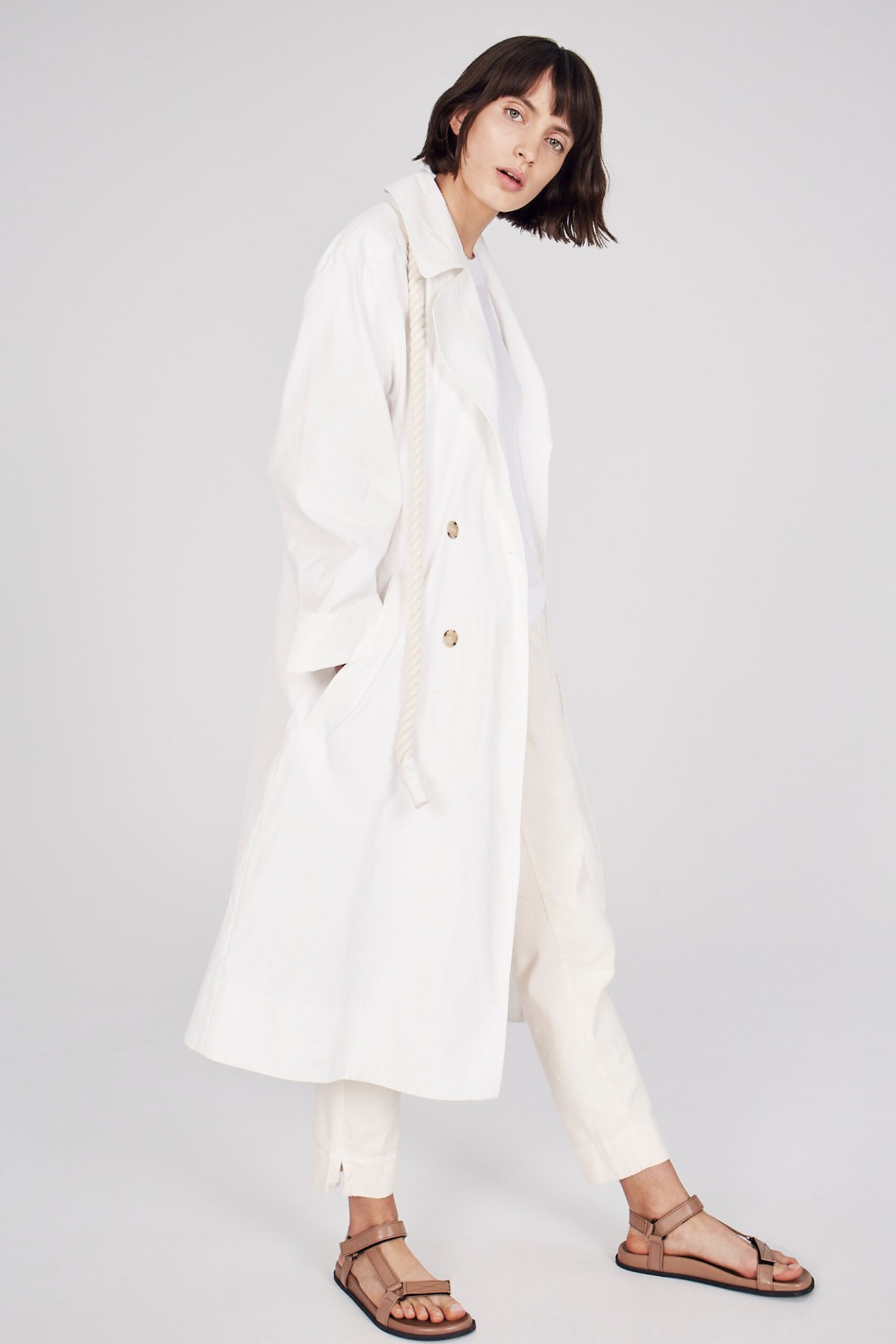 white cotton long-sleeve collared oversized buttoned coat