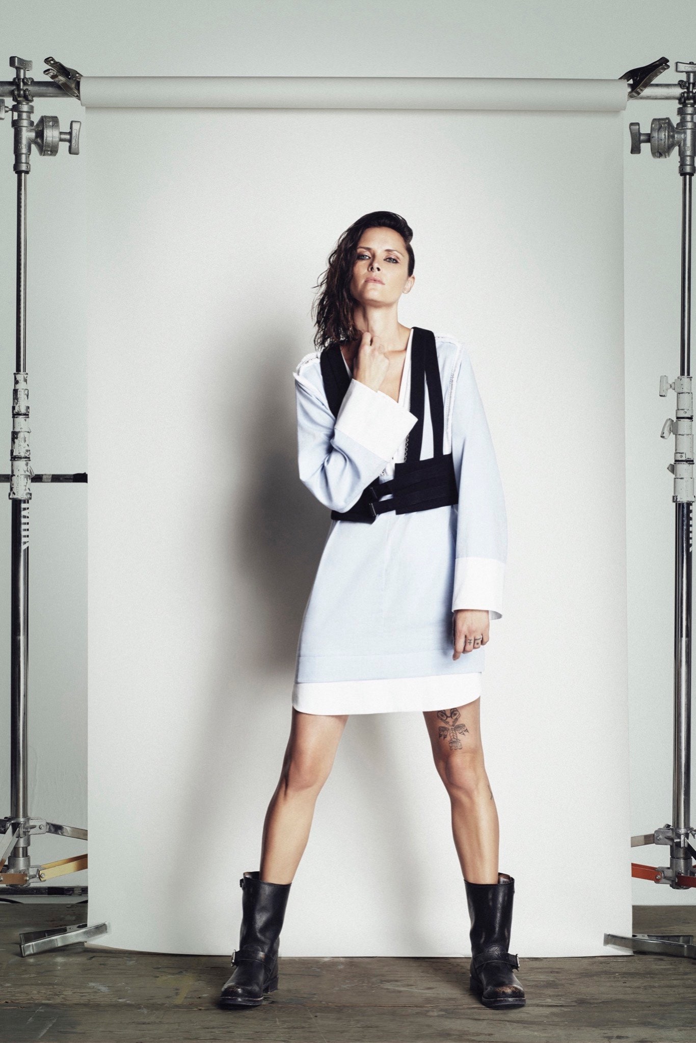 blue and white fitted dress with black vest