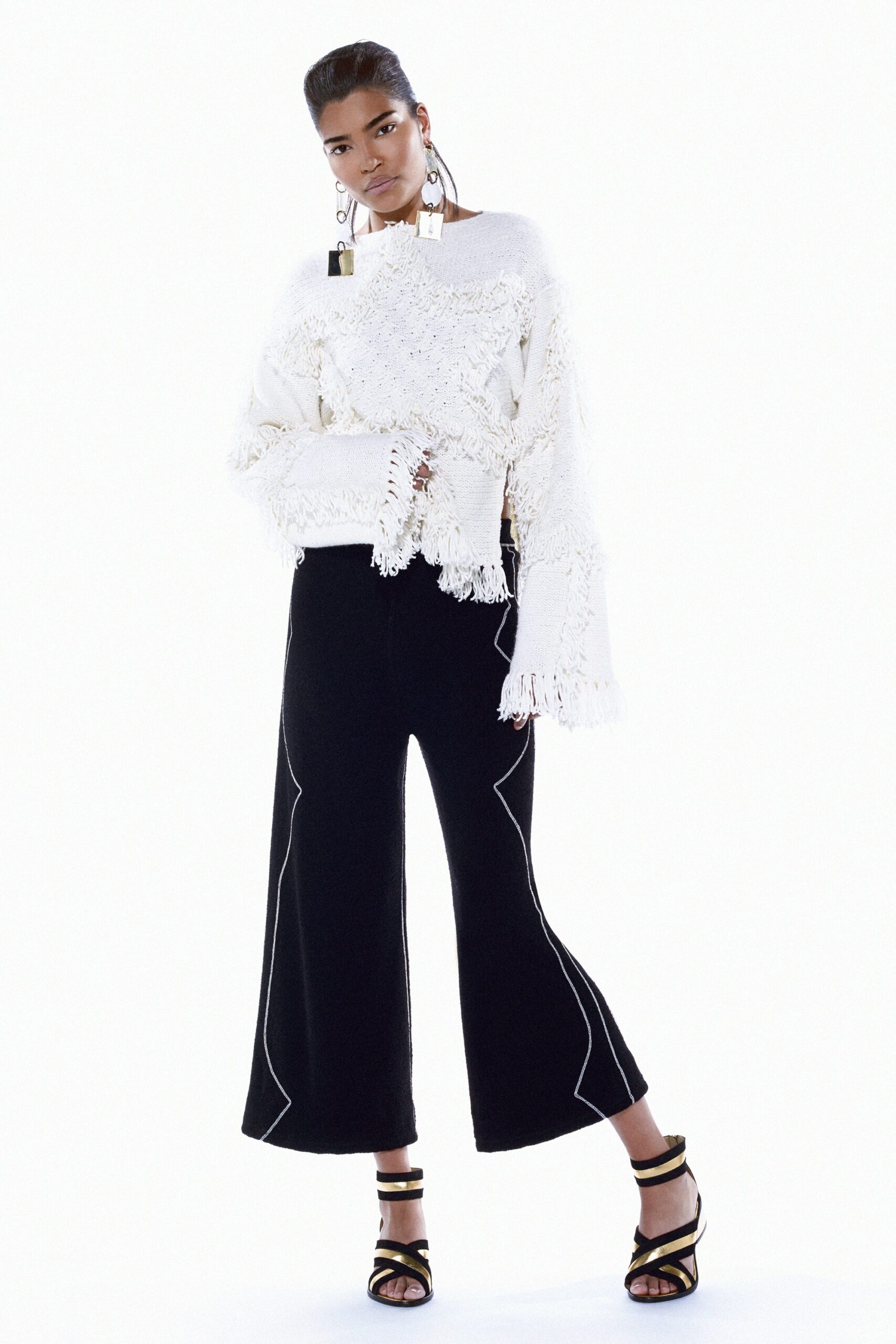 white relaxed top with black wide-leg pants