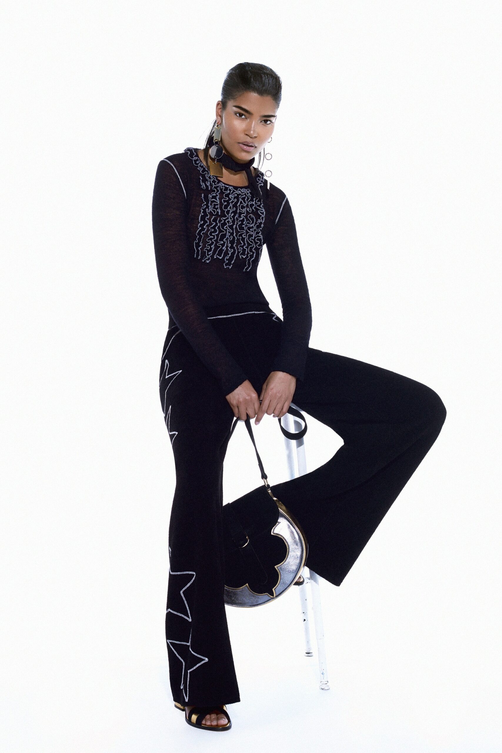 black fitted top and flared pants