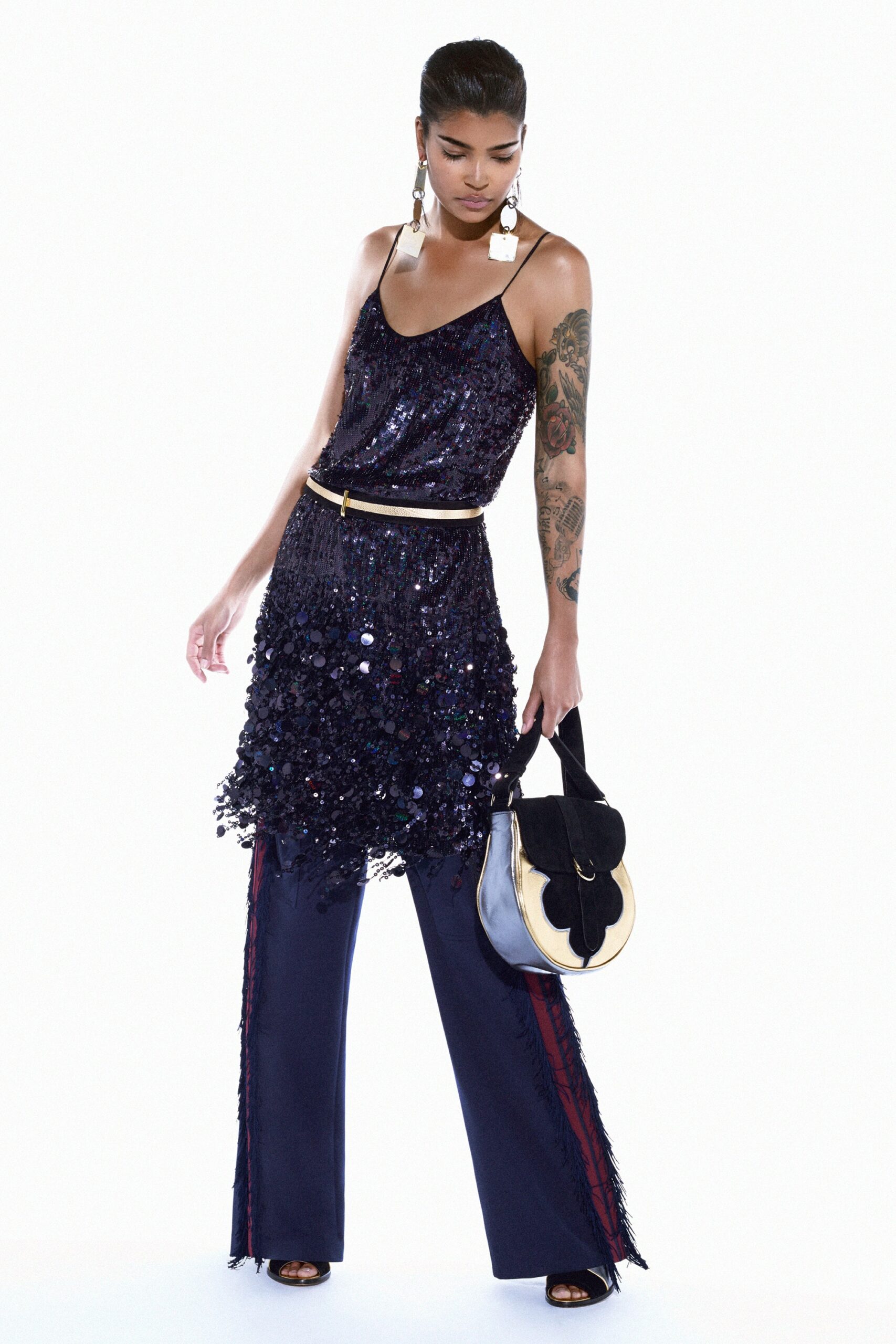 blue sequined sleeveless top and navy flared pants