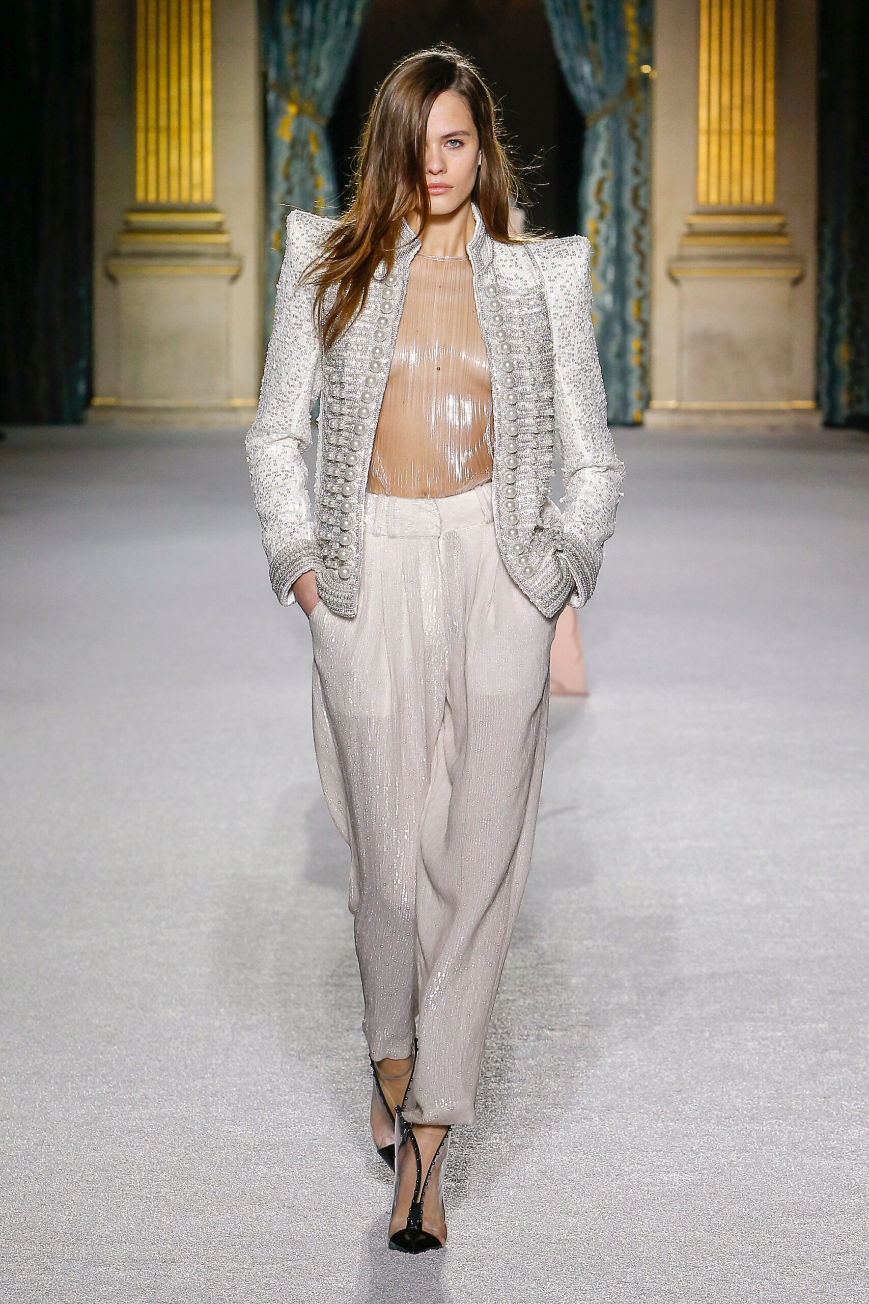 structured white silk jacket with beige pants