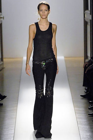 black fitted tank-top and flared pants