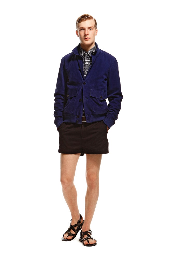 blue fitted jacket with black shorts