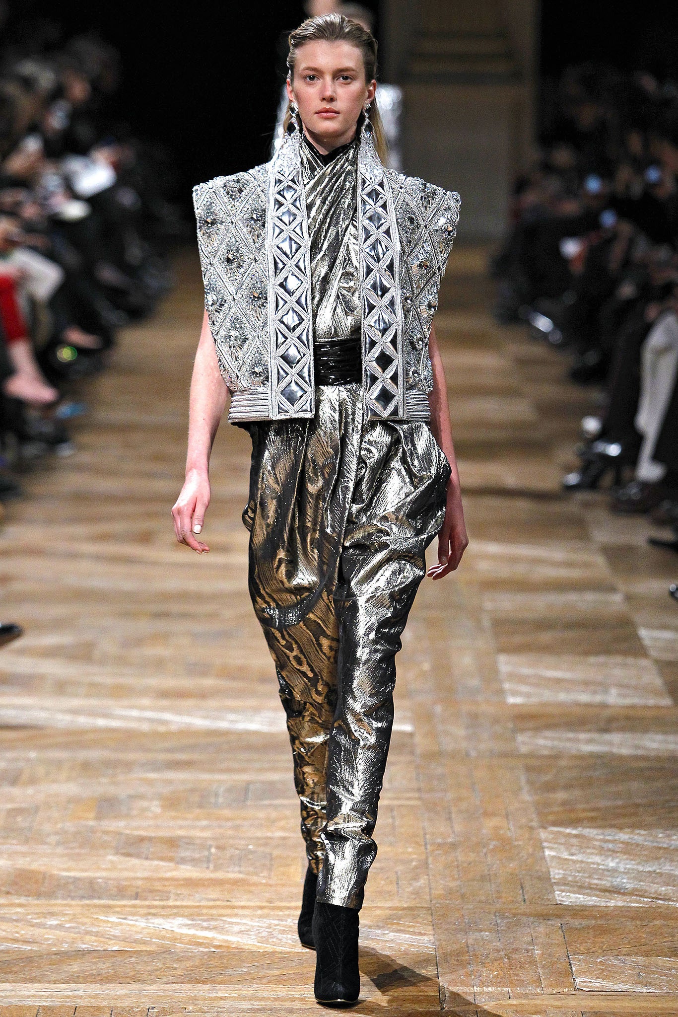 silver metallic fitted jumpsuit with gray embroidered cape