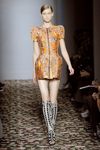 fitted orange mini dress with laced black boots