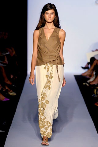 brown silk sleeveless top and white embroidered pants