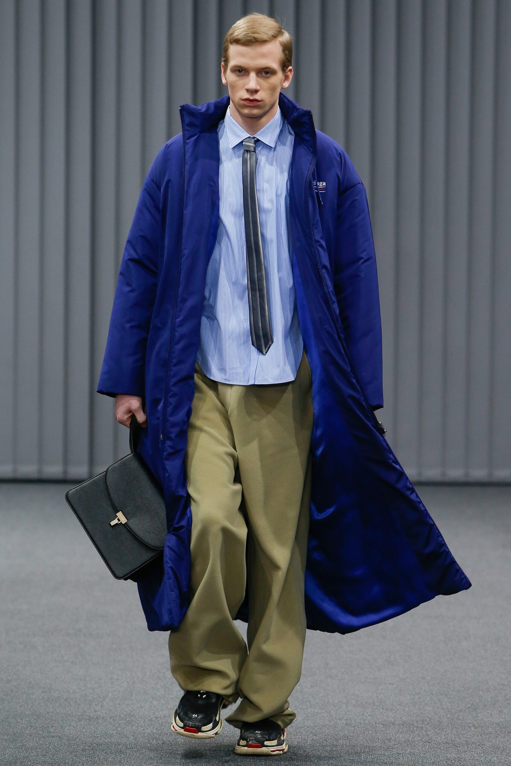 blue vinyl coat with beige pants