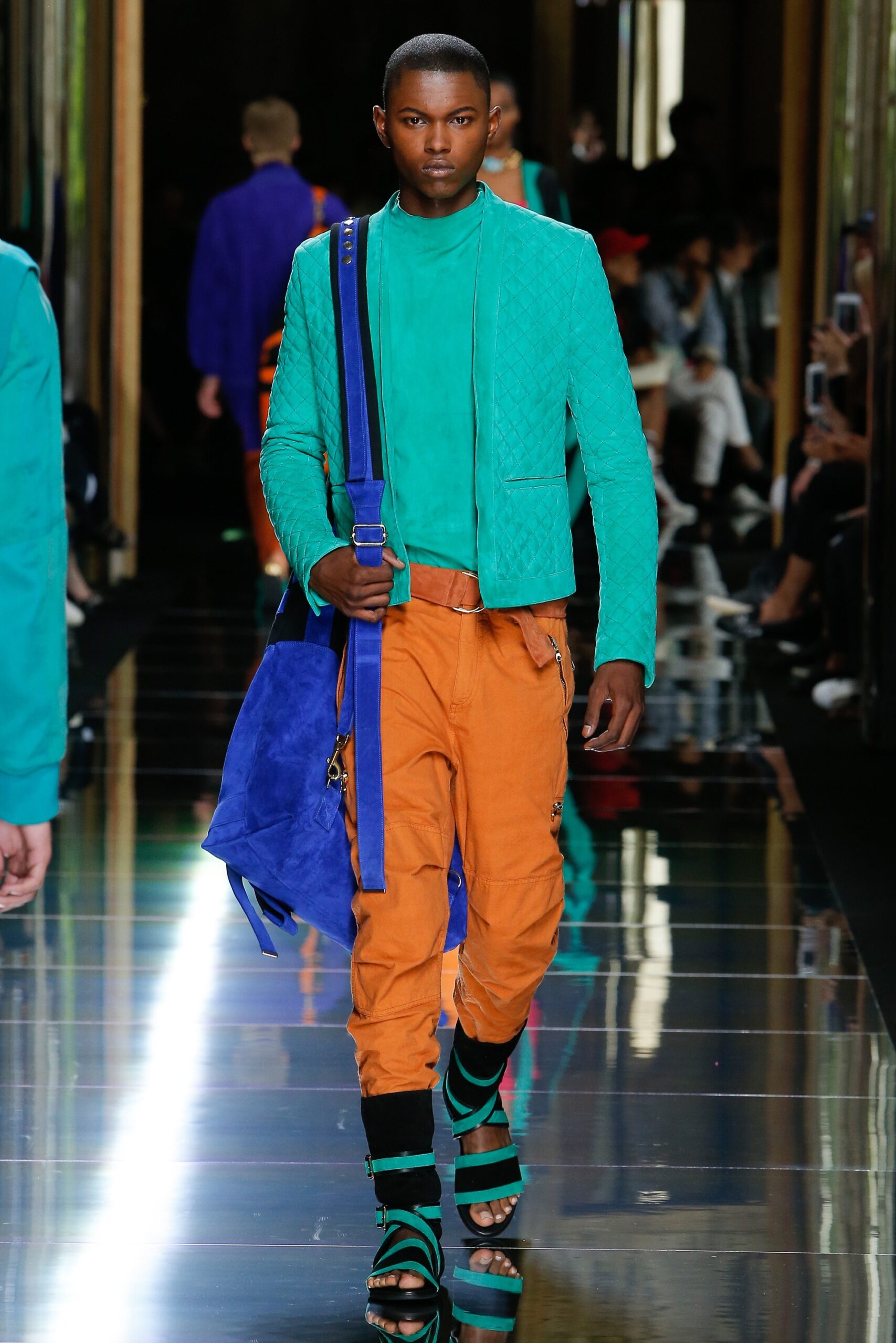 green fitted jacket with orange pants