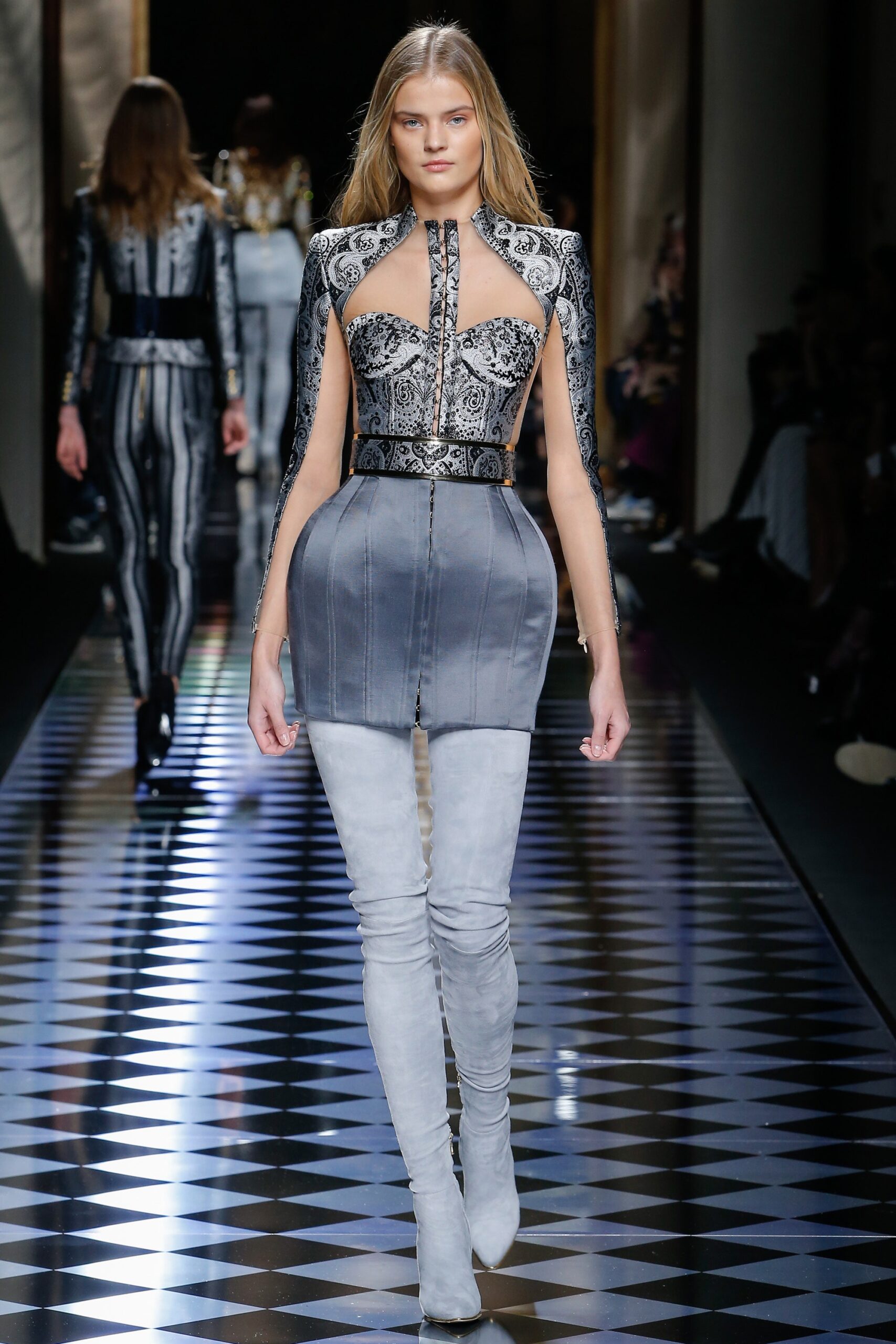 fitted gray mini dress with thigh-high boots