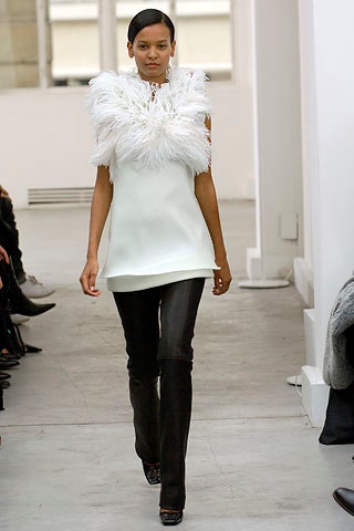 white fringed top with black pants