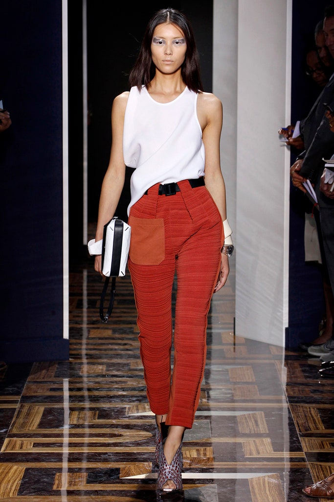 white fitted top with red pants