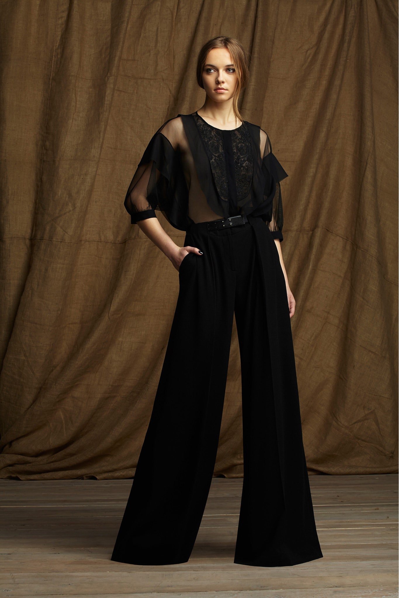 black sheer blouse and tailored pants