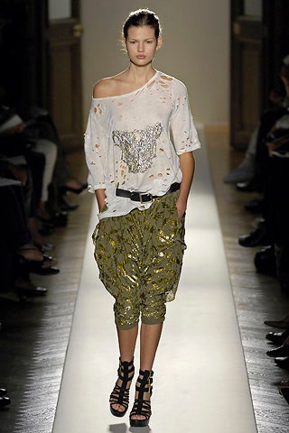 white off-shoulder top with green cargo pants