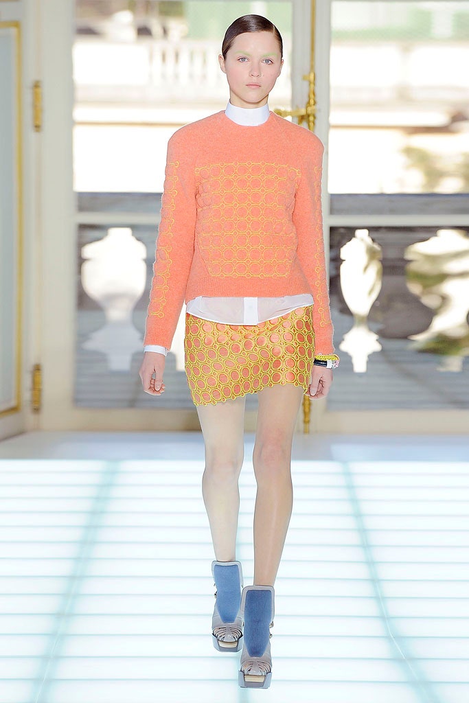 orange fitted top with yellow mini skirt