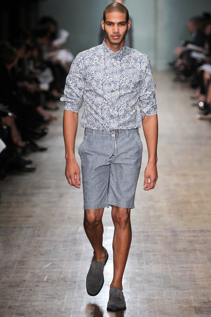 blue printed shirt with gray shorts
